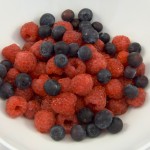 Delicious blueberry and raspberry desset in plain white bowl.